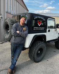 Dave poses in front of Sean's Jeep