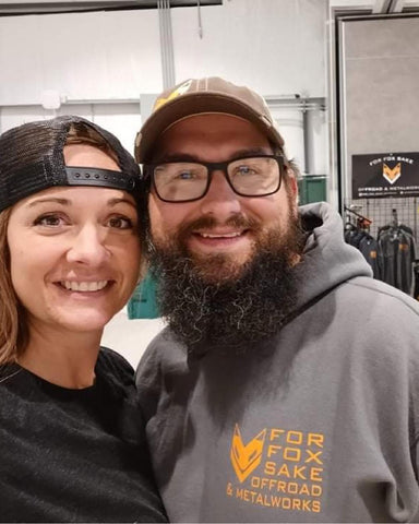 Jess and Sean smiling at a charity Jeep show