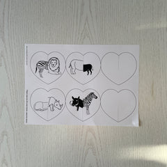 Print out of hearts on paper with mismatched animals
