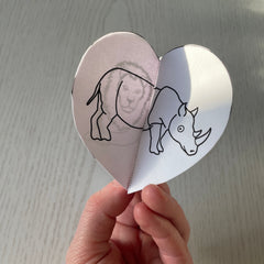 3D paper heart wit illustration of a rhino from the little black and white book project