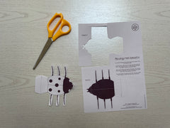 scissors and a cut out ladybird template