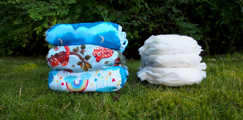 reusable nappies and disposable nappies next to each other in a pile