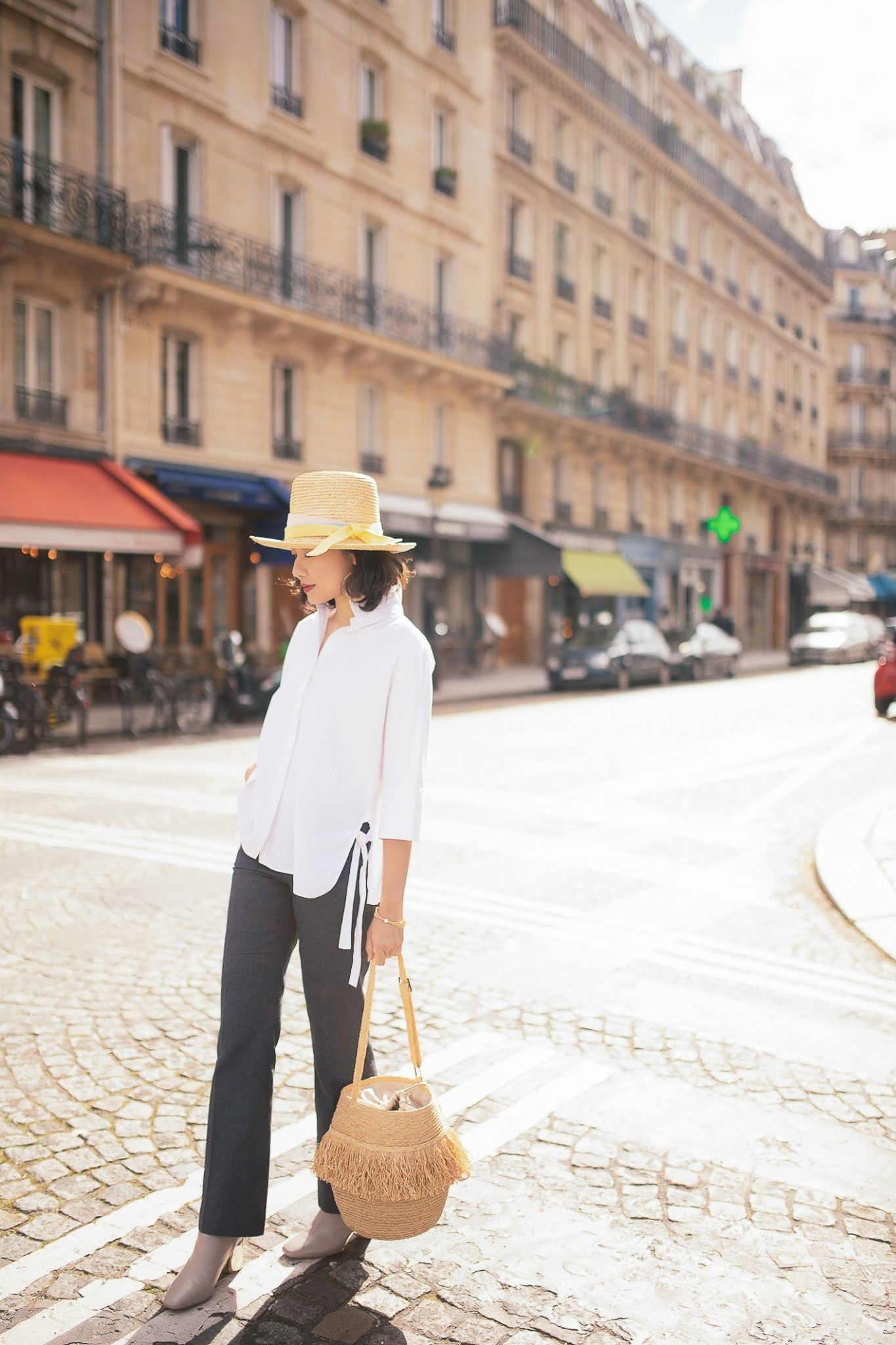 Mimi-Minh Nguyen in Paris with bucket Simon mini and Modernist hat, photo by Anh Huy Pham