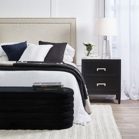 A stylish black and white bed