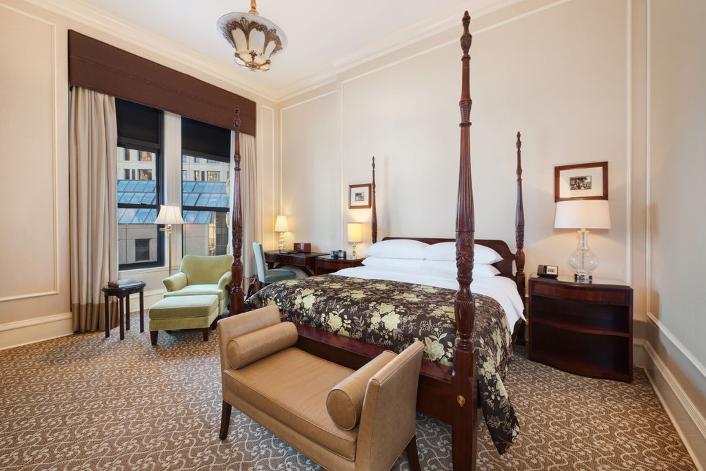 The lavishly decorated interior of the Governor’s Suite guest room at The Pfister Hotel.