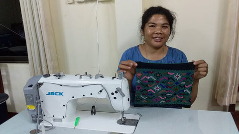 Hmong trainee learning to make pillow case