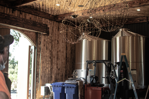 Installation of Lee Display's Hanging Spheres for the Hill Family Winery's newest tasting experience