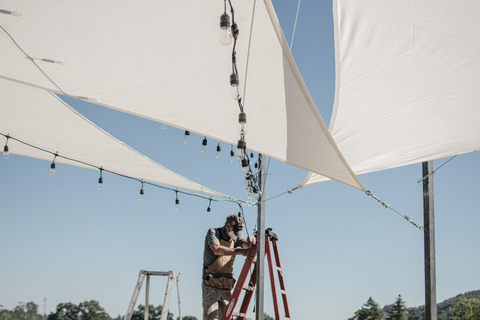 Installation of Lee Display's Vintage Patio Lights for the Hill Family Winery's newest tasting experience