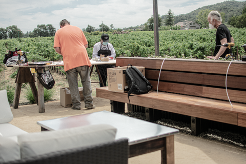 Installation begins on the outdoor canopy design for the wineries patio seating - Lee Display