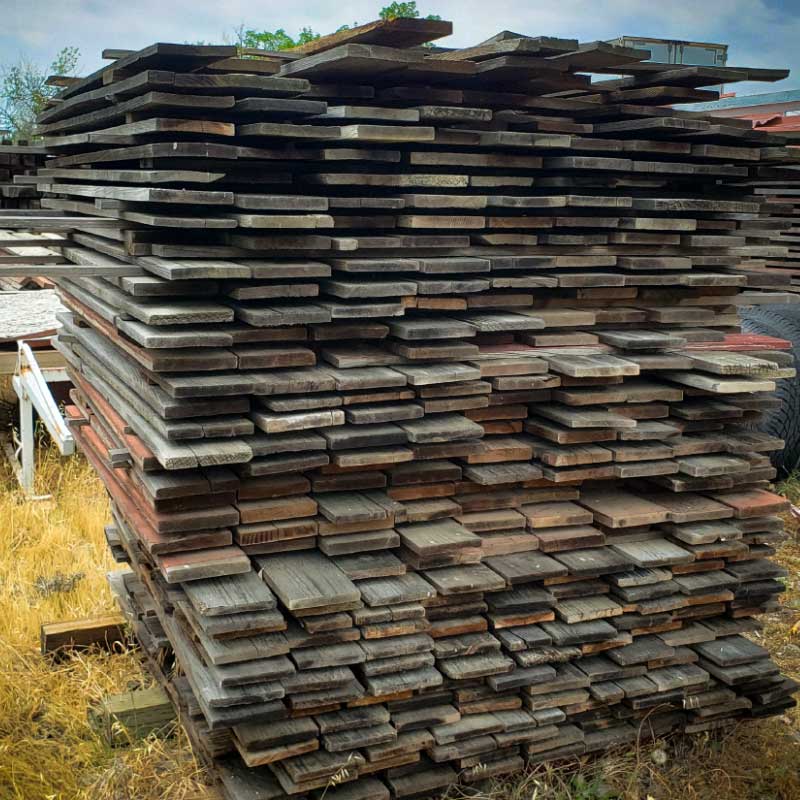 Lee Display works with local fencing and contracting companies in Northern California to purchase their old redwood materials and repurpose it into usable products.  Pile of Lumber