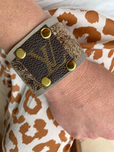 Load image into Gallery viewer, Beautiful leather cuff crafted from cloud gray Deerskin, featuring a metallic leather overlay and vintage LV canvas square accent.