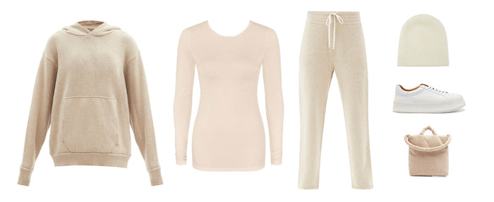 Fashion styling flatlay of cream jumper, thermal top, tracksuit pants