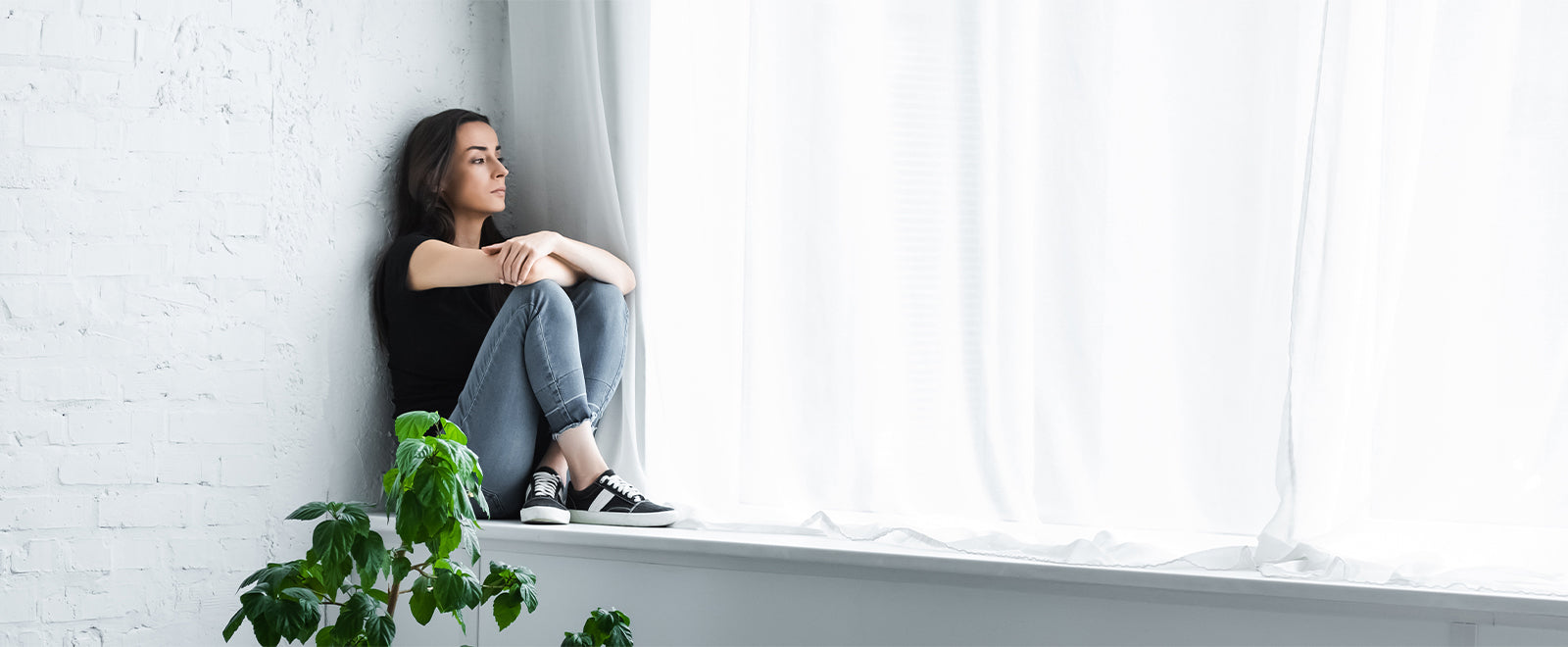 Woman looking out window