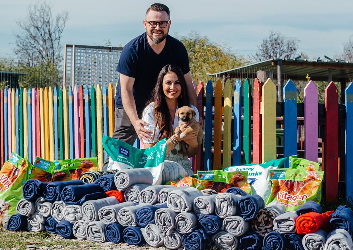 Valgray Project Cuddles & Crunchies Charity Drive Blog Image 2 of Marco and Rhode from Valgray holding up donations to Fallen Angels Pet Rescue thanks to the Project Cuddles & Crunchies Charity Drive in South Africa.