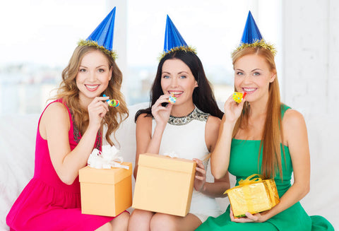Three women celebrating at a bachelorette party