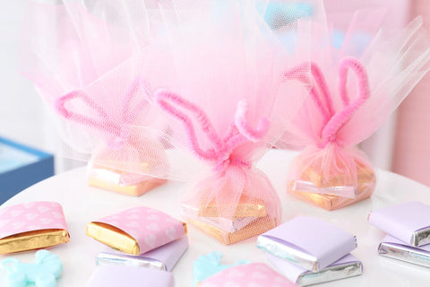 baby shower party favors on a table