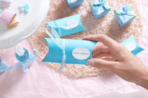woman holding baby shower favors