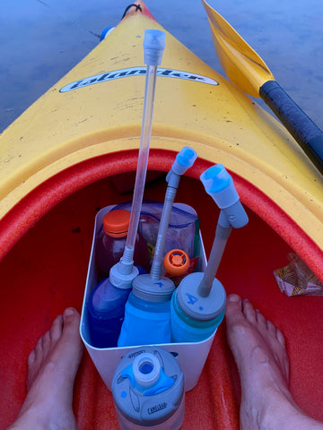 Adrienne's feed station in the front of the kayak