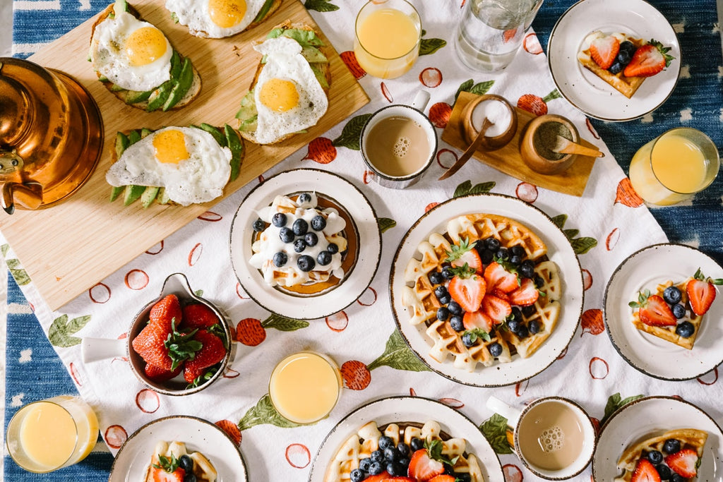 Second Breakfast: A beautiful table spread of waffles, eggs, fresh fruit, and more