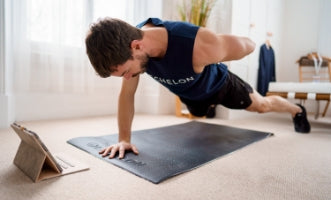 Man doing a one arm press-up following an Echelon programme