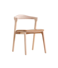 Inspired by Scandinavian design, the Tahora Dining Chair will be a perfect addition to any modern space. Made from solid wood, it's sleek lines and curved frame create a simple elegance. Featuring a durable, long lasting cushion for extra comfort. Available in natural, matte black, or warm brown finishes.