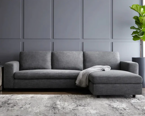 Clean lines and comfortable seating make this a stylish sofa chaise perfect for lounging. Stocked in a marble and quarry fabric with black solid wood legs. A great addition to modern and contemporary spaces. Right hand facing chaise, also available in left hand facing.