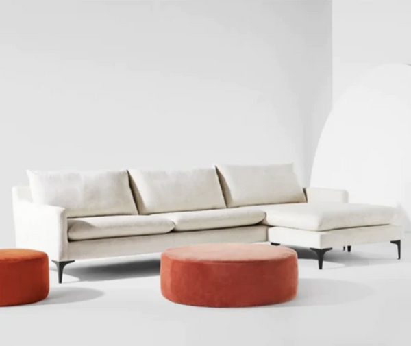 The Anders sectional sofa strikes an inviting profile, its clean lines are softened by plush cushions. The integrated ottoman allows for placement to the left or right.