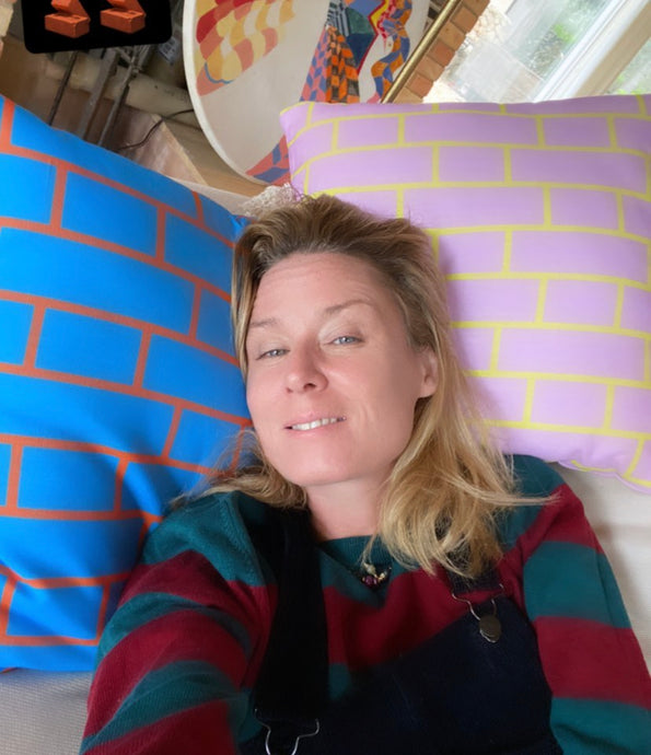 Roisin Murphy resting on brick hatch cushions by Adam Nathaniel Furman