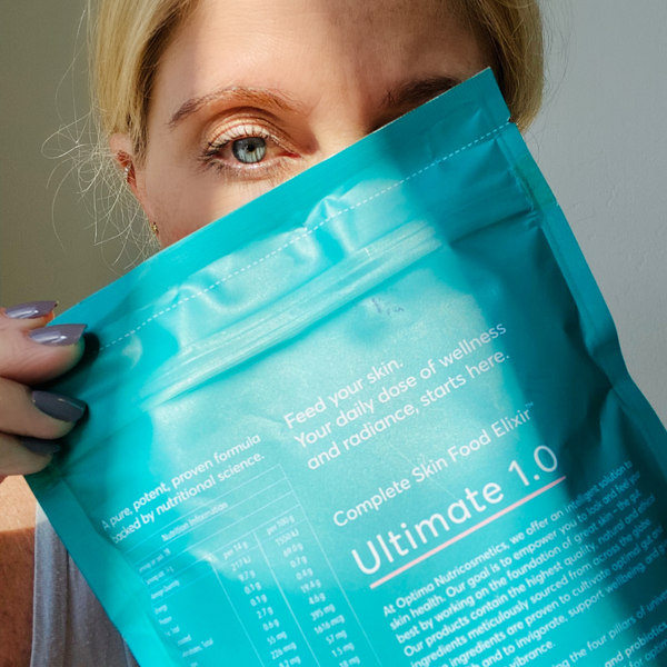 woman holding bag of Ultimate Skin Food