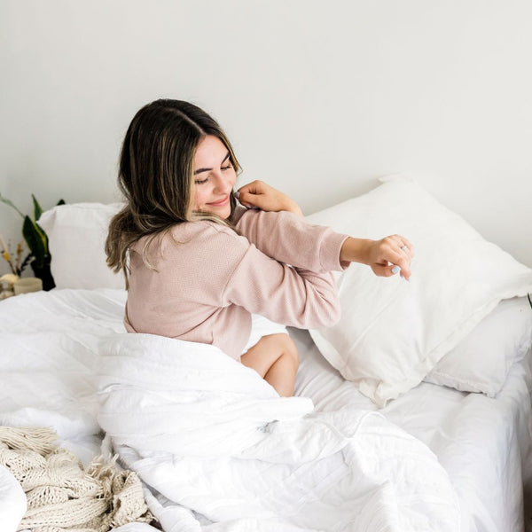 woman waking up refreshed