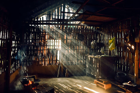 old barn interior with light shining through wood and windows