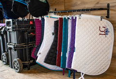  You can also use blanket bars and hangers to hang your saddle pads and blankets. 
