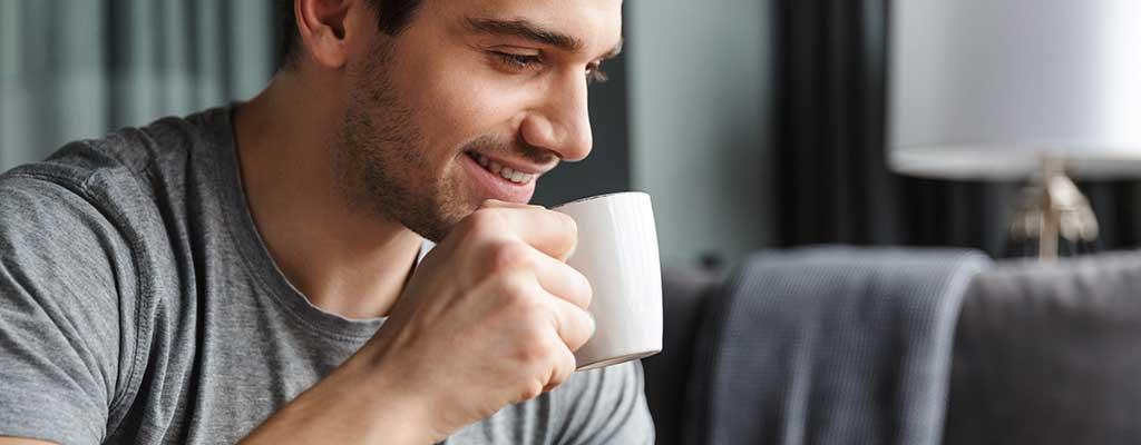 man drinking his morning tea