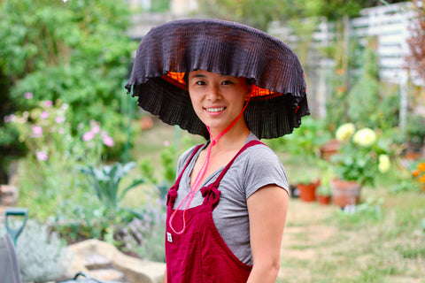 “This picture was taken in my old garden in the summer wearing a traditional Hakka hat called a leung mao, identical to the one my grandma wore when she was a rice farmer.”