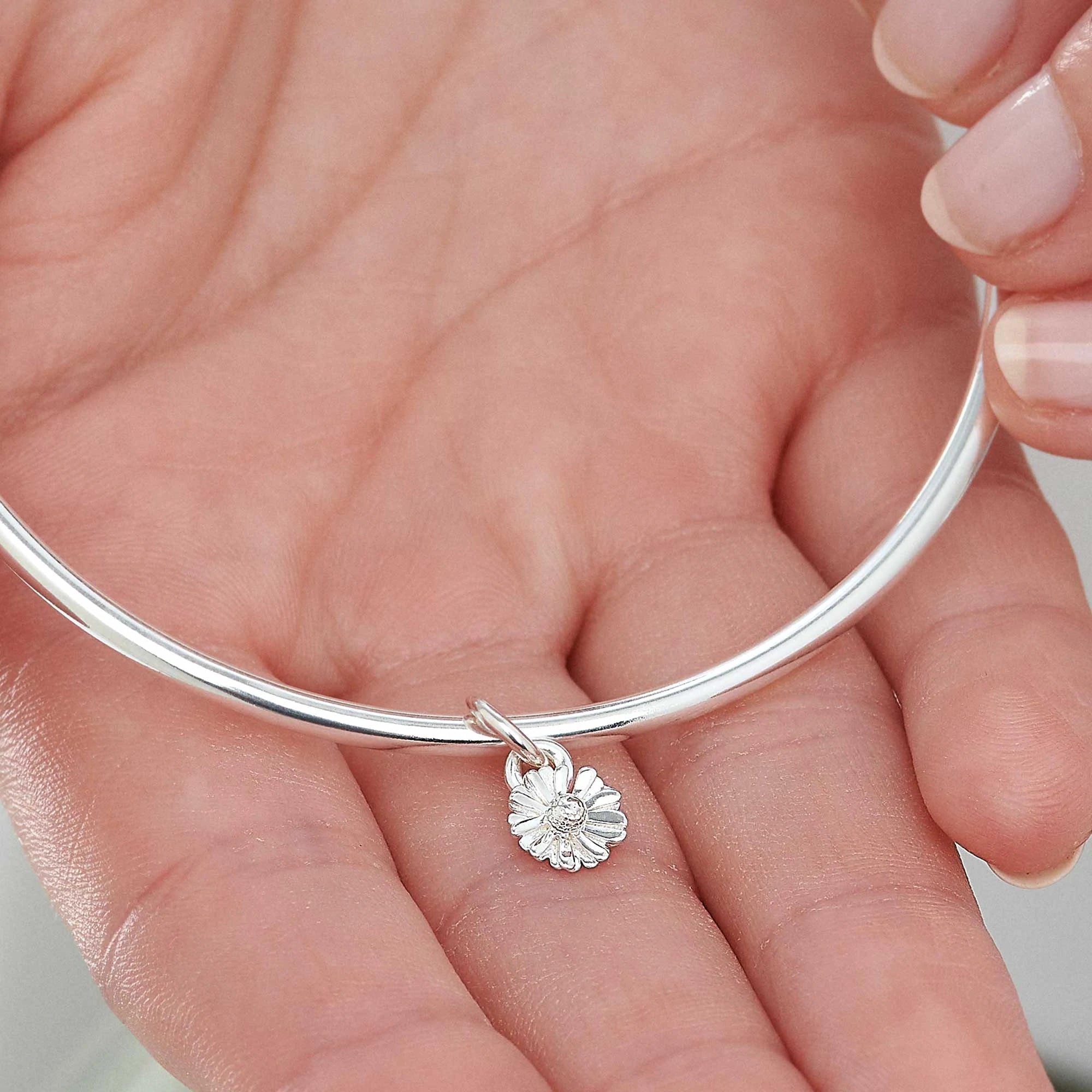 daisy april birth flower silver charm bangle made in the UK recycled silver Scarlett Jewellery