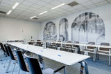 Large meeting room with a U shaped seating arrangement