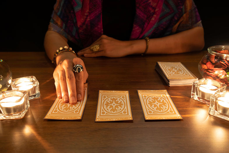 tarot reader picking cards face down