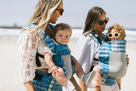 Two mUms with their children - one facing in, one facing out.