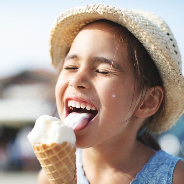 Little girl eating an ice cream cone