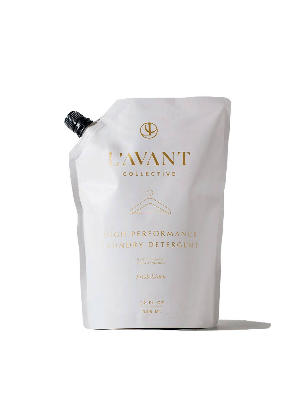 This is a refill for the L'Avant Collective Laundry Detergent. Light grey 32 fluid ounces or 946 milliliters. It is a high performance laundry detergent that smells like Fresh Linen. It has gold lettering and a black plastic cap which is easy to open and close by turning it and it is on the left of the bag. The picture is on a light background with a shadow. 