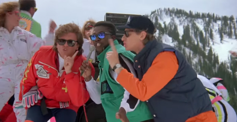 three men sing songs on a snowy mountain