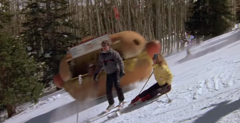 a hot dog stand falls down a snowy hill