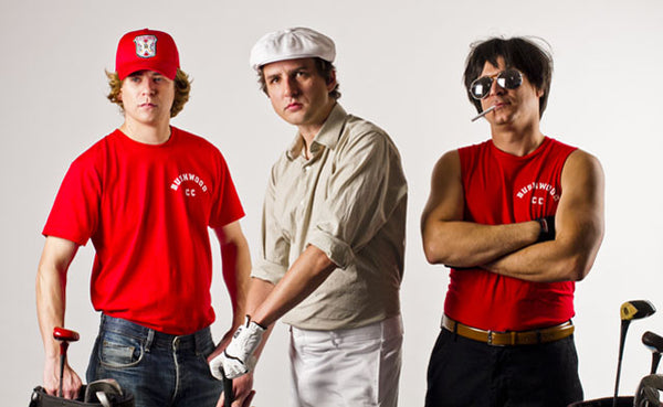 three men dressed as characters from the movie caddyshack