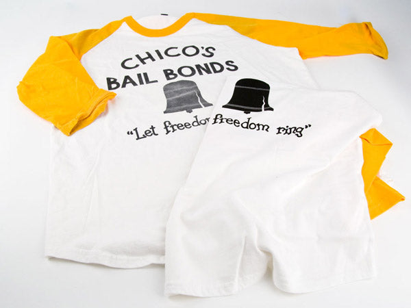 two chico's bail bonds t-shirts, one is aged with faded text and one is new with crisp black text