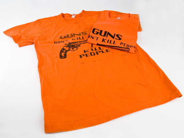 two orange t-shirts, one is brand new and one has been aged