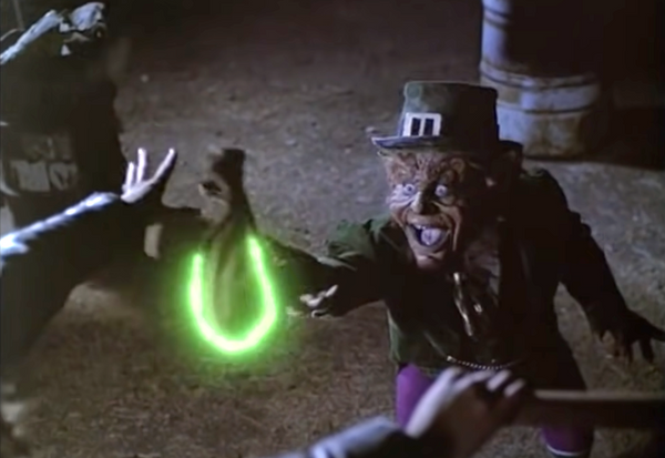 a leprechaun takes a bag of gold that is glowing