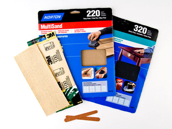 a variety of sandpaper samples and nail files