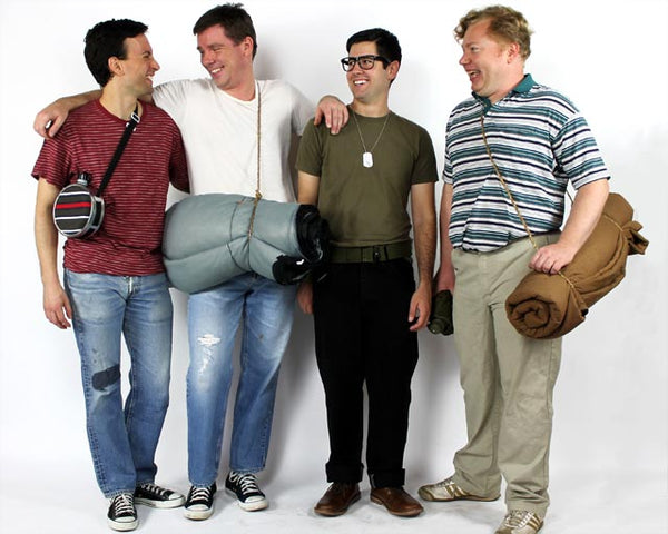 four men dressed as characters from the movie stand by me