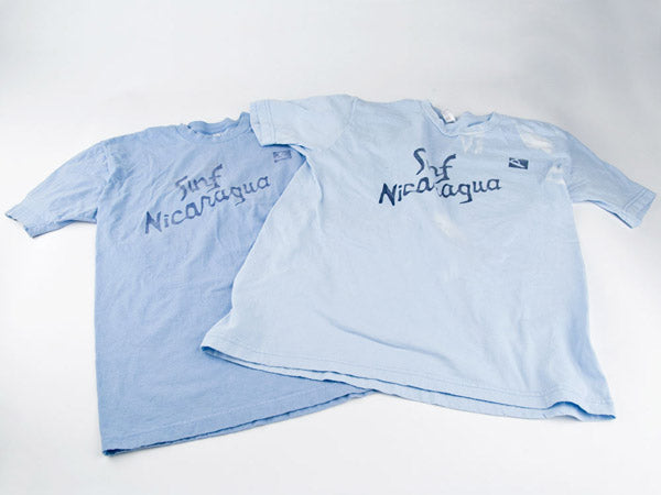 two blue surf nicaragua t-shirts that have been faded