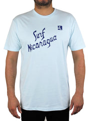 light blue t-shirt with the words "Surf Nicaragua" on the front in dark blue letters, with a small picture of a surfer.